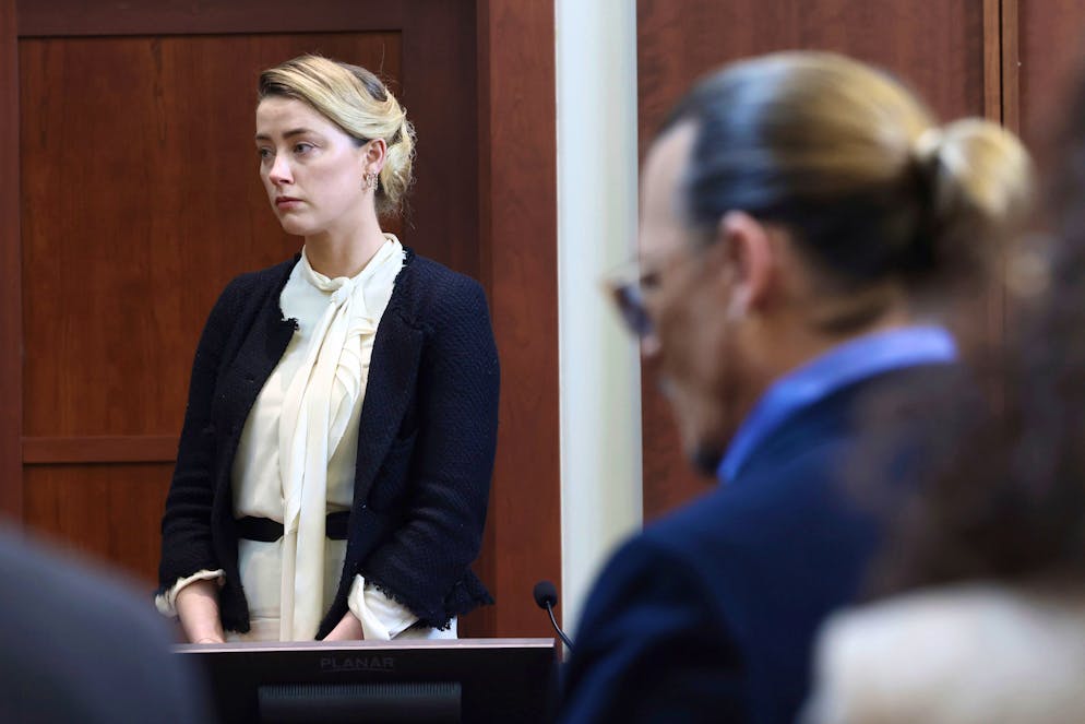 Actor Amber Heard, left, and actor Johnny Depp appear in the courtroom at the Fairfax County Circuit Court in Fairfax, Va., Thursday, May 5, 2022. Depp sued his ex-wife Heard for libel in Fairfax County Circuit Court after she wrote an op-ed piece in The Washington Post in 2018 referring to herself as a