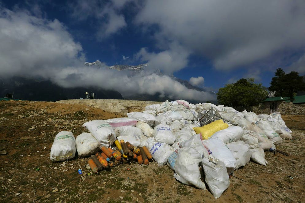 Sacks of garbage collected from Mount Everest is seen in Namche Bajar, Solukhumbu district, Nepal, Monday, May 27, 2019. The garbage will be sent to Kathmandu for recycling. (AP Photo/Niranjan Shrestha)