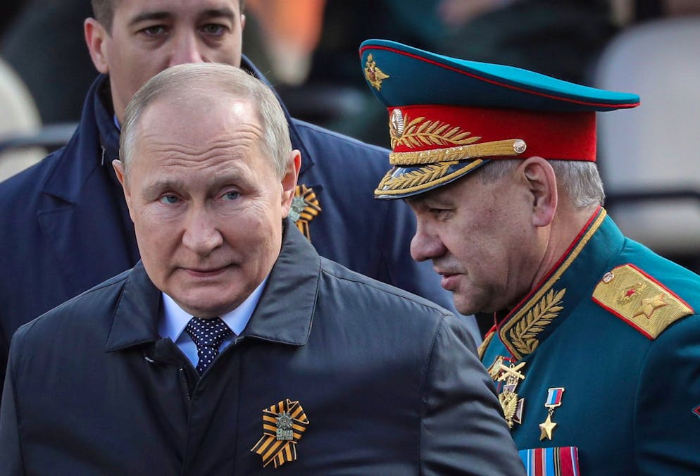 epa09935430 Russian President Vladimir Putin (L) and Russian Defense Minister Sergei Shoigu leave the Red Square after the Victory Day military parade in Moscow, Russia, 09 May 2022. Russia marks Victory Day, Nazi Germany's unconditional surrender in World War 2, with the annual parade in Moscow's Red Square on 09 May, after more than two months of attacks on Ukraine. EPA/MAXIM SHIPENKOV