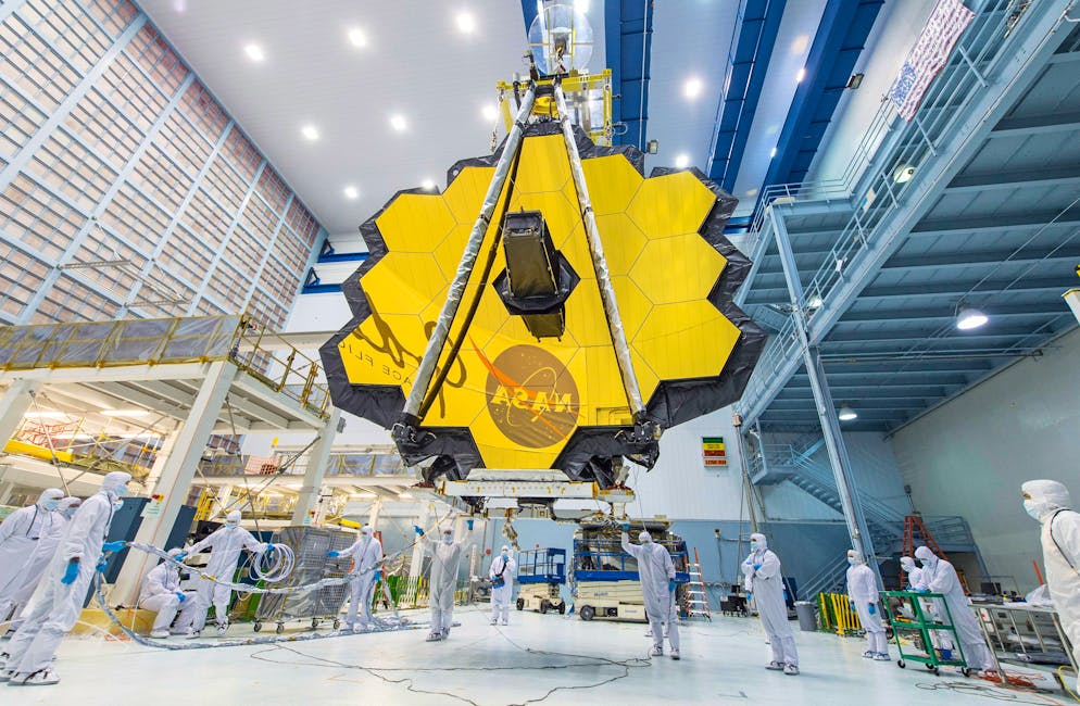 epa09614360 (FILE) - An undated handout file picture made available by the National Aeronautics and Space Administration (NASA) shows NASA technicians lifting the James Webb Space Telescope using a crane and moving it inside a clean room at NASA's Goddard Space Flight Center in Greenbelt, Maryland, USA (issued 01 December 2021). According to NASA, engineering teams have completed additional testing confirming NASA's James Webb Space Telescope (JWST) is ready for flight, and launch preparations are resuming toward Webb's target launch date on 22 December 2021, at 7:20 a.m. EST. Webb's primary mirror will collect light for the observatory in the scientific quest to better understand our solar system and beyond. The JWST is an international project led by NASA with its European (ESA) and Canadian (CSA) partners. EPA/NASA/Desiree Stover HANDOUT HANDOUT EDITORIAL USE ONLY/NO SALES