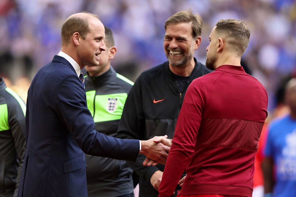Britain's Prince William shakes hands with Liverpool's team captain Jordan Henderson, right, as Liverpool's manager Jurgen Klopp looks on before the start of the English FA Cup final soccer match between Chelsea and Liverpool, at Wembley stadium, in London, Saturday, May 14, 2022. (AP Photo/Ian Walton)