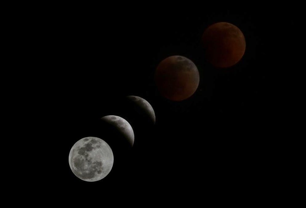 BOGOTA, COLOMBIA - MAY 15: (EDITORS NOTE: Multiple exposures were combined to produce this image) The moon is in eclipse on Sunday night from Bogota, Colombia on May 15, 2022. (Photo by Juancho Torres/Anadolu Agency via Getty Images)