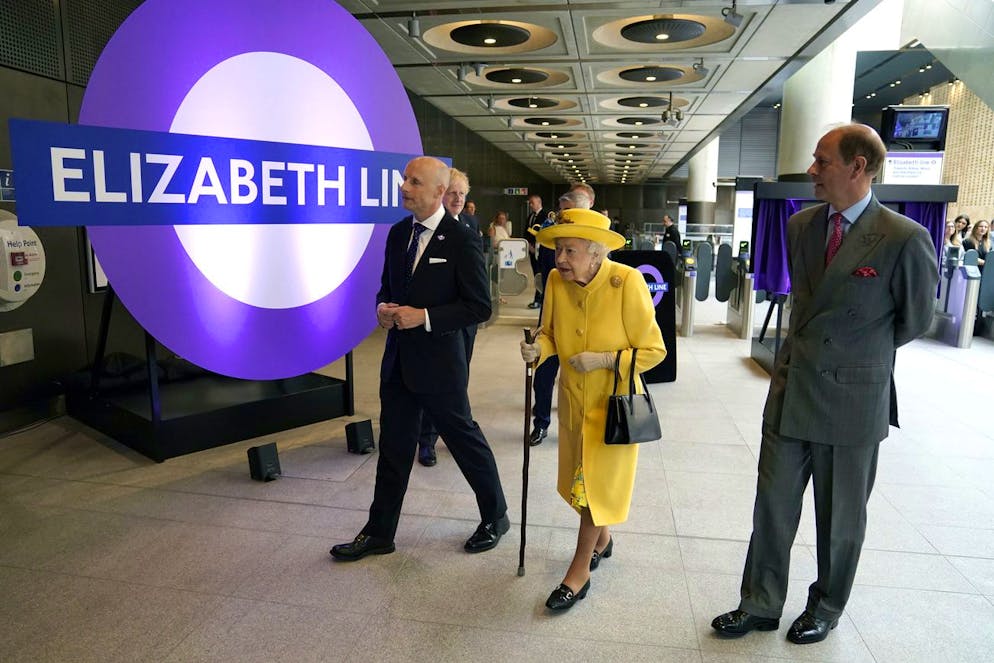 Britain's Queen Elizabeth II and Prince Edward, right, talks with Transport for London commissioner Andy Byford, left, at Paddington station in London meets staff of the Crossrail project, as well as Elizabeth Line staff who will be running the railway, to mark the completion of London's Crossrail project, Tuesday, May 17, 2022. (Andrew Matthews/Pool via AP)
