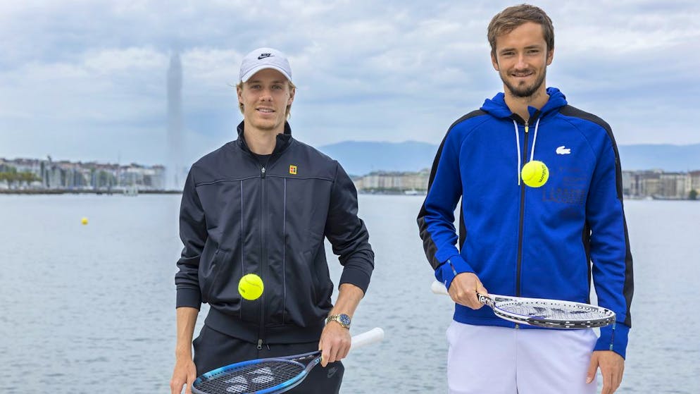 Denis Shapovalov, left, of Canada, and Daniil Medvedev, right, of Russia, pose for photographers in the plage des Eaux-Vives with the famous water fountain