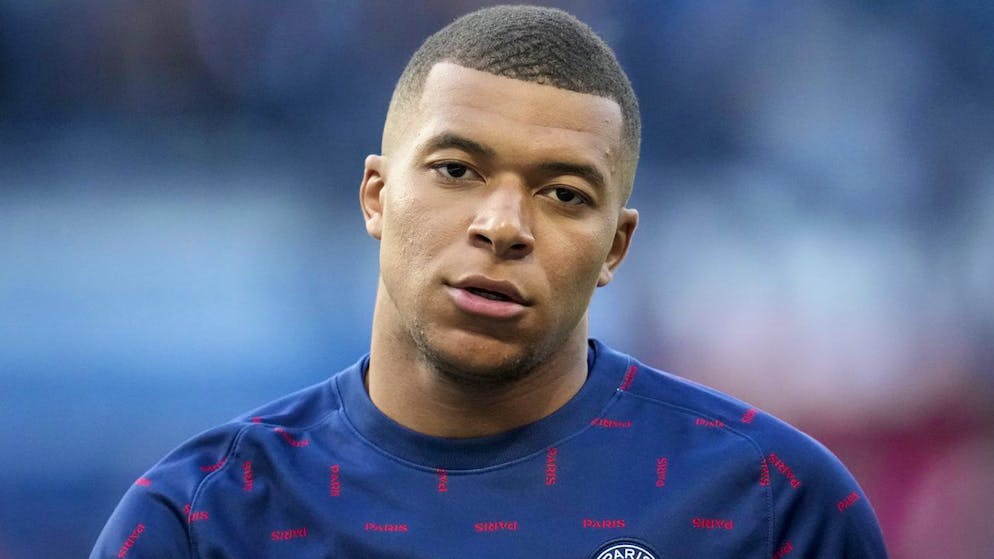 PSG's Kylian Mbappe warms up prior to the start of the French League One soccer match between Paris Saint Germain and Troyes at the Parc des Princes stadium in Paris, Sunday, May 8, 2022. (AP Photo/Christophe Ena)