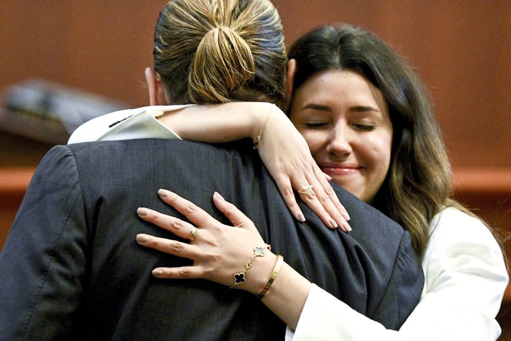 Actor Johnny Depp hugs attorney Camille Vasquez in the courtroom at the Fairfax County Circuit Courthouse in Fairfax, Va., Tuesday, May 17, 2022. Actor Johnny Depp sued his ex-wife Amber Heard for libel in Fairfax County Circuit Court after she wrote an op-ed piece in The Washington Post in 2018 referring to herself as a