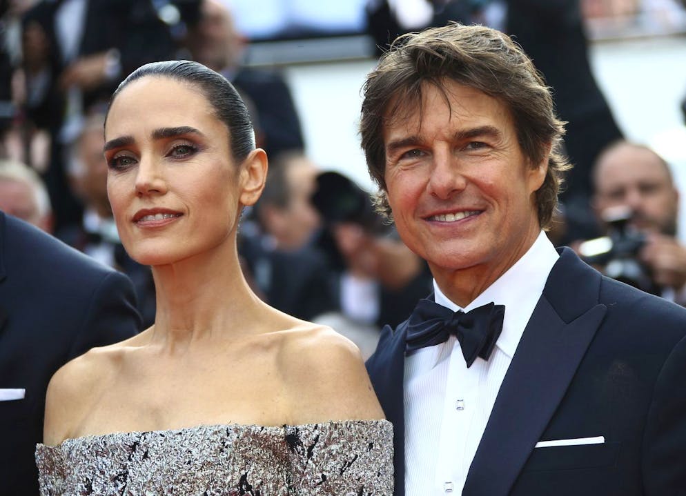 Jennifer Connelly, left, and Tom Cruise pose for photographers upon arrival at the premiere of the film 'Top Gun: Maverick' at the 75th international film festival, Cannes, southern France, Wednesday, May 18, 2022. (Photo by Joel C Ryan/Invision/AP)