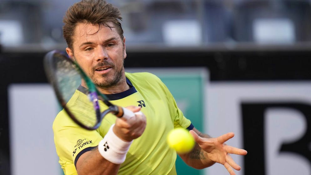 Switzerland's Stan Wawrinka returns the ball to Serbia's Novak Djokovic during their match at the Italian Open tennis tournament, in Rome, Thursday, May 12, 2022. (AP Photo/Alessandra Tarantino)