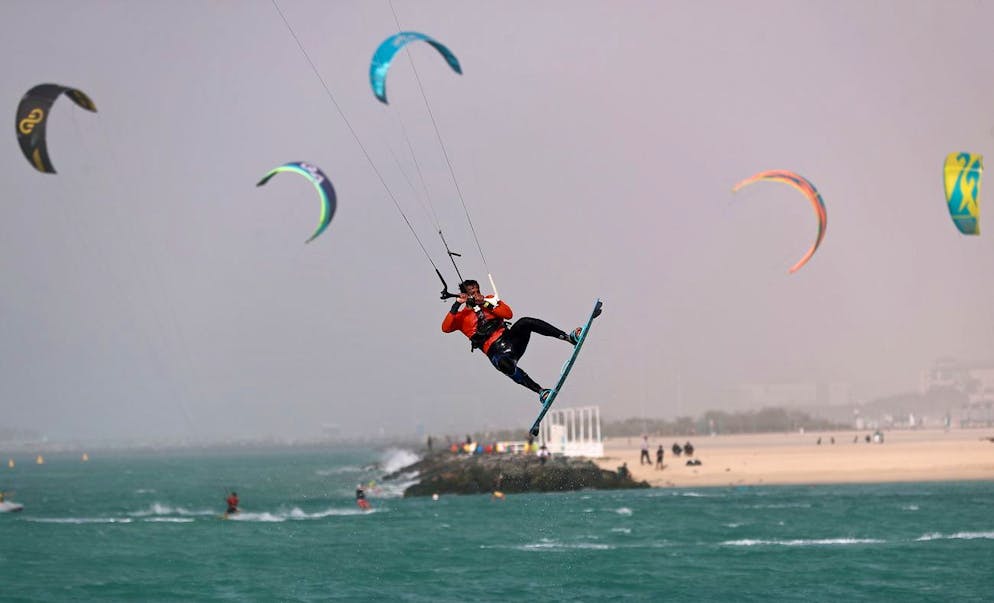 epa08960099 A Kitesurfer in action during the Dubai Kitesurf Open 2021 in Gulf emirate of Dubai, United Arab Emirates on 23 January 2021. Dubai International Marine Club is hosting Dubai Kitesurf Open 2021. EPA/ALI HAIDER