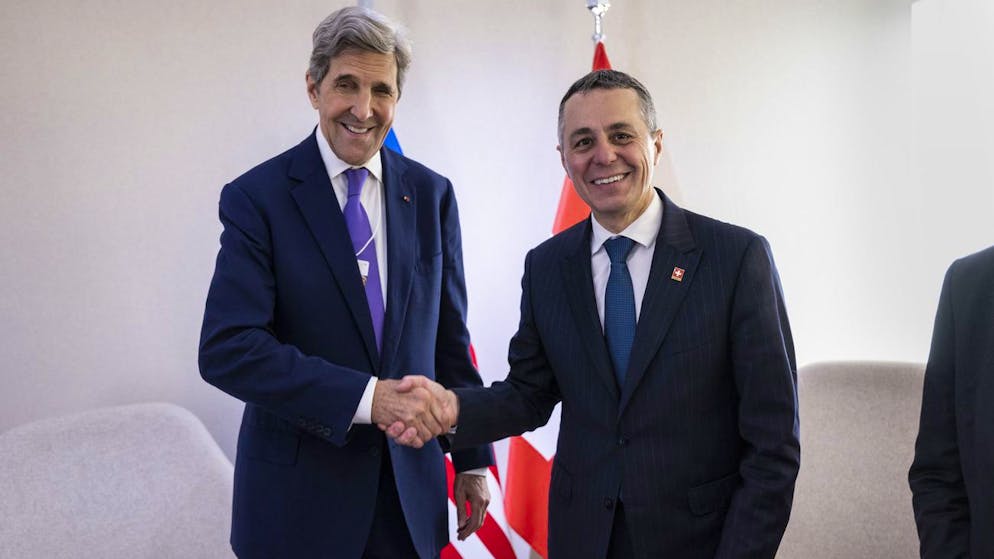 Ignazio Cassis, President of the Swiss Confederation, right, welcomes John Kerry, former US Secretary of State and current United States special presidential envoy for climate, during the 51st annual meeting of the World Economic Forum, WEF, in Davos, Switzerland, on Monday, May 23, 2022. The forum has been postponed due to the Covid-19 outbreak and was rescheduled to early summer. The meeting brings together entrepreneurs, scientists, corporate and political leaders in Davos under the topic