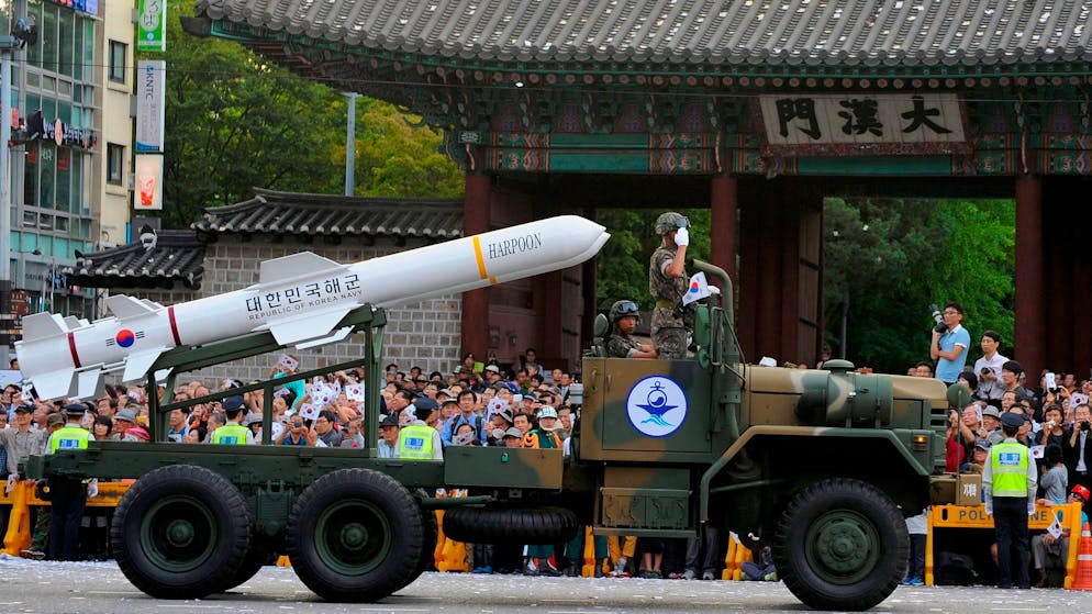 epa03890716 South Korean Army soldiers and a 'Harpoon' cruise missile parade during the 65th Armed Forces Day on the main street in Seoul, South Korea, 01 October 2013. South Korean President Park Geun-Hye said during an Armed Forces Day ceremony, South Korea will build strong defense capabilities to deter threats from North Korea and render the North's nuclear weapons useless. EPA/LEE JUN-SANG