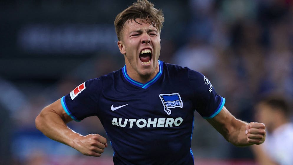 Hertha Berlin's Norwegian defender Fredrik Andre Bjorkan celebrates at the final whistle of the German Bundesliga Relegation Play-Off second-leg football match Hamburg SV v Hertha Berlin in Hamburg, northen Germany, on May 23, 2022. - Hertha Berlin won the match and will remain in the Bundesliga first divison next season. - DFL REGULATIONS PROHIBIT ANY USE OF PHOTOGRAPHS AS IMAGE SEQUENCES AND/OR QUASI-VIDEO (Photo by RONNY HARTMANN / AFP) / DFL REGULATIONS PROHIBIT ANY USE OF PHOTOGRAPHS AS IMAGE SEQUENCES AND/OR QUASI-VIDEO (Photo by RONNY HARTMANN/AFP via Getty Images)