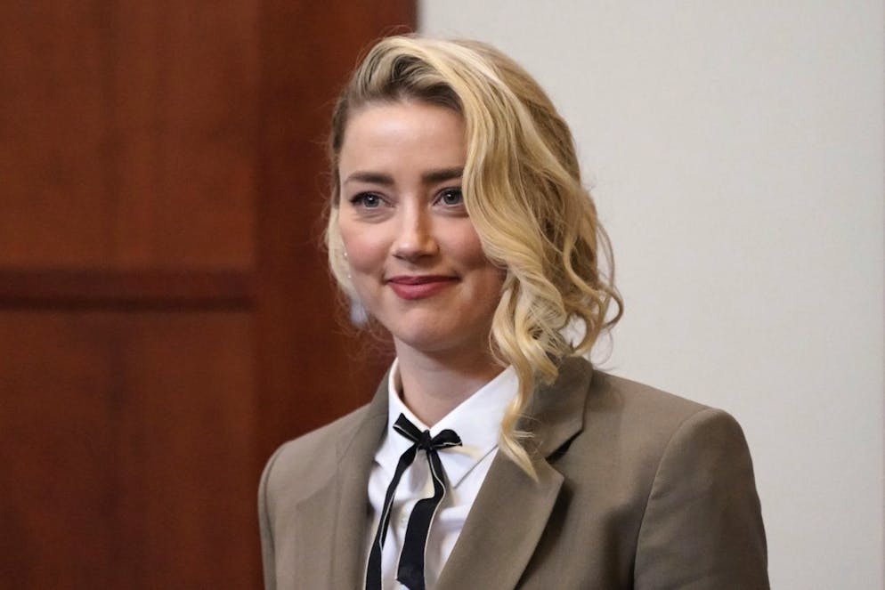 epa09969650 Actor Amber Heard arrives into the courtroom after a break at the Fairfax County Circuit Courthouse in Fairfax, Virginia, USA, 23 May 2022. Johnny Depp's 50 million US dollar defamation lawsuit against Amber Heard started on 10 April. EPA/Steve Helber / POOL