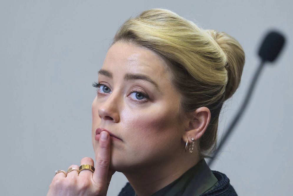 Actor Amber Heard listens in the courtroom in the Fairfax County Circuit Courthouse in Fairfax, Va., Wednesday, May 25, 2022. Actor Johnny Depp sued his ex-wife Amber Heard for libel in Fairfax County Circuit Court after she wrote an op-ed piece in The Washington Post in 2018 referring to herself as a 