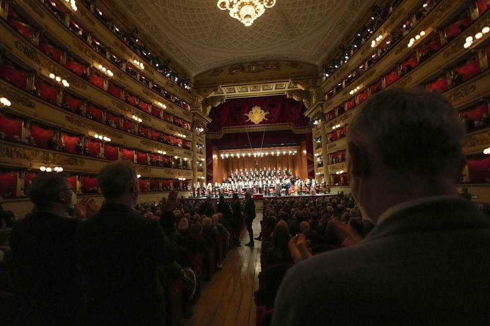 People applaud at the end of the La Scala orchestra pro-Ukraine fundraising 'Concert for Peace' at La Scala opera house in Milan, Italy, Monday, April 4, 2022. The proceeds collected by the Fondazione di Comunità Milano and the Italian Red Cross will go in support of the Ukrainian refugees fleeing their country battered by war. (AP Photo/Luca Bruno)