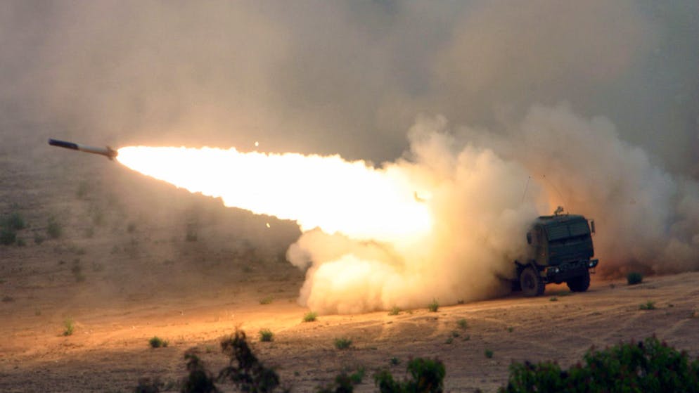 U.S. Marine Corps Marines, Tango Battery, 5th Battalion, 11th Marine Regiment, 1st Marine Division, fire a Multiple Launch Rocket System Family of Munitions (MFOR) rocket from a High Mobility Artillery Rocket System (HIMARS) launcher at Camp Pendleton, Calif., on June 1, 2007. The HIMARS system consists of one launcher, two re-supply vehicles, two re-supply trailers and a basic load of nine pods (six rockets per pod) of MFOR rockets. (U.S. Marine Corps photo by Lance Cpl. Seth Maggard) (Released)