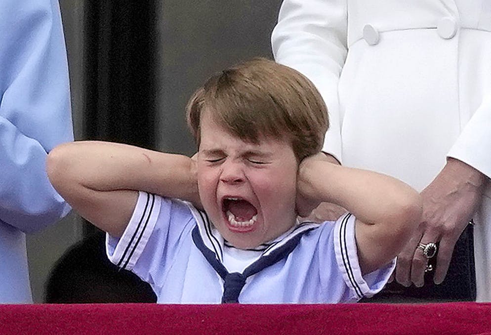 Britain's Prince Louis, great-grandson of Queen Elizabeth II, covers his ears with his hands on the balcony of Buckingham Palace, London, Thursday June 2, 2022, on the first of four days of celebrations to mark the Platinum Jubilee. The events over a long holiday weekend in the U.K. are meant to celebrate the monarch's 70 years of service. (AP Photo/Alastair Grant)