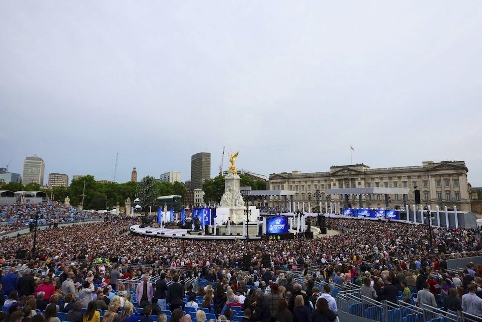 Crowds gather in advance of the Platinum Jubilee concert taking place in front of Buckingham Palace, London, Saturday June 4, 2022, on the third of four days of celebrations to mark the Platinum Jubilee. The events over a long holiday weekend in the U.K. are meant to celebrate Queen Elizabeth IIâÄ™s 70 years of service. (Hannah McKay/Pool Photo via AP)