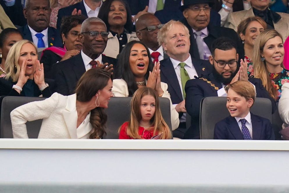 Front row from left, Britain's Kate, Duchess of Cambridge, Princess Charlotte and Prince George at the Platinum Jubilee concert taking place in front of Buckingham Palace, London, Saturday June 4, 2022, on the third of four days of celebrations to mark the Platinum Jubilee. The events over a long holiday weekend in the U.K. are meant to celebrate Queen Elizabeth IIâÄ™s 70 years of service. ( Jacob King/PA via AP)