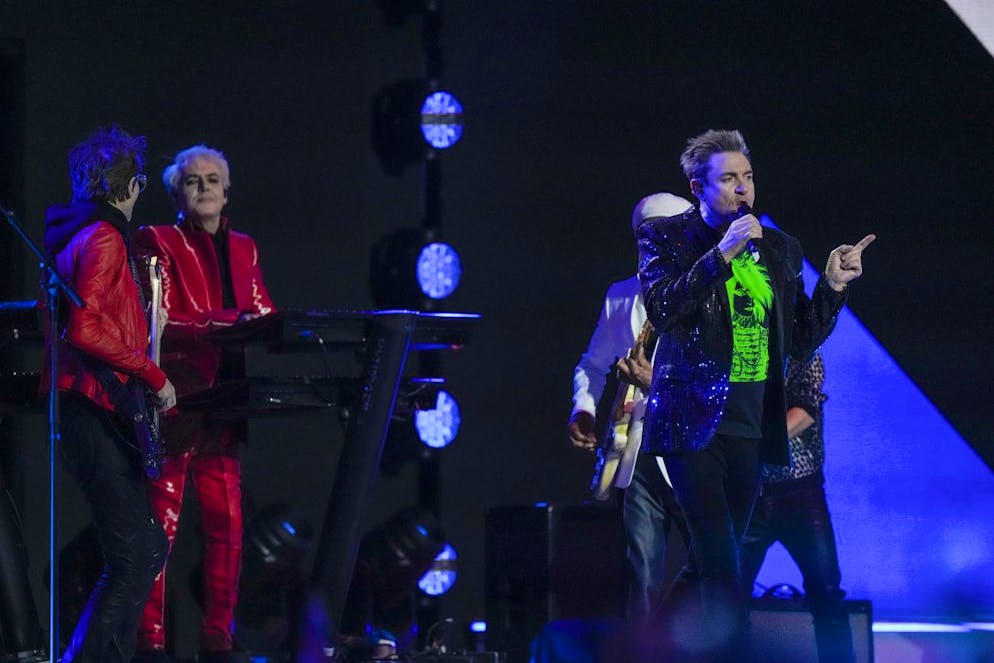 Simon Le Bon, right, and members of the band Duran Duran perform at the Platinum Jubilee concert taking place in front of Buckingham Palace, London, Saturday June 4, 2022, on the third of four days of celebrations to mark the Platinum Jubilee. The events over a long holiday weekend in the U.K. are meant to celebrate Queen Elizabeth II's 70 years of service. (AP Photo/Alastair Grant, Pool)