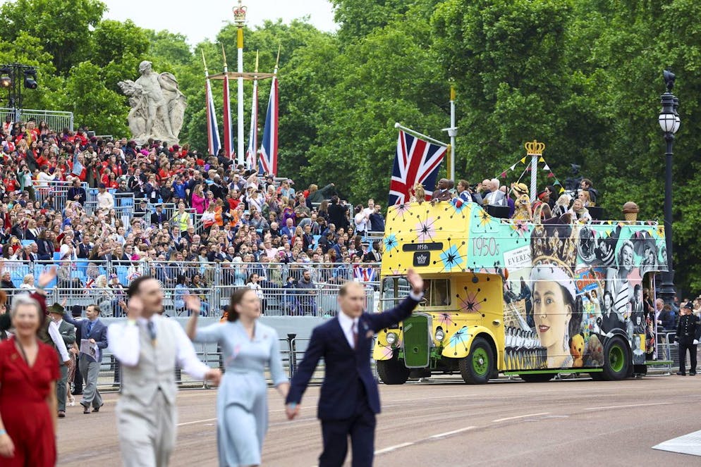 A bus drives during the Platinum Jubilee Pageant, in London, Sunday June 5, 2022, on the last of four days of celebrations to mark the Platinum Jubilee. The pageant will be a carnival procession up The Mall featuring giant puppets and celebrities that will depict key moments from Queen Elizabeth IIâÄ™s seven decades on the throne. (Hannah McKay/Pool Photo via AP)