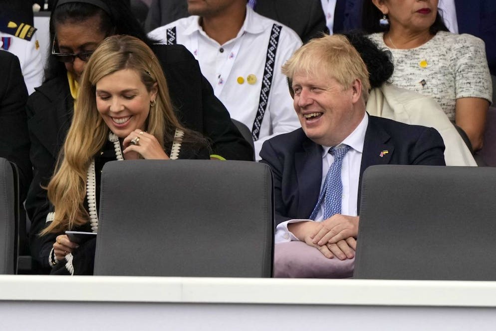 Britain's Prime Minister Boris Johnson, right, and his wife Carrie Symonds attend the Platinum Jubilee Pageant outside Buckingham Palace in London, Sunday, June 5, 2022, on the last of four days of celebrations to mark the Platinum Jubilee. The pageant will be a carnival procession up The Mall featuring giant puppets and celebrities that will depict key moments from the Queen Elizabeth II's seven decades on the throne. (AP Photo/Frank Augstein, Pool)