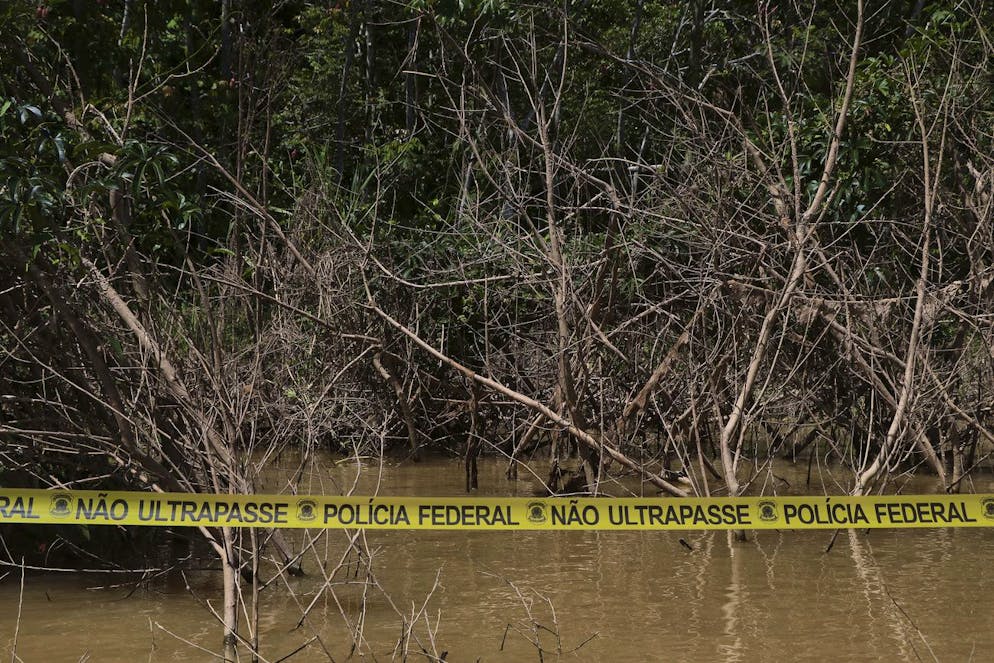 Police tape cordons an area where Indigenous expert Bruno Pereira and freelance British journalist Dom Phillips disappeared in Atalaia do Norte, Amazonas state, Brazil, Tuesday, June 14, 2022. The search for Pereira and Phillips, who disappeared in a remote area of Brazil's Amazon continues following the discovery of a backpack, laptop and other personal belongings submerged in a river. (AP Photo/Edmar Barros)