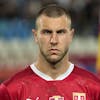 Serbia's Strahinja Pavlovic stands during the playing of his country's national anthem before the UEFA Nations League soccer match between Serbia and Norway at the Rajko Mitic Stadium in Belgrade, Serbia, Thursday, June 2, 2022. (AP Photo/Darko Vojinovic)