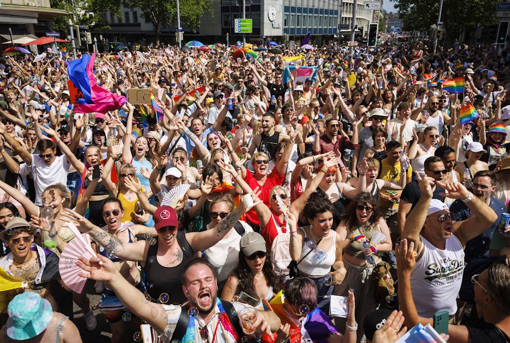 epa10020256 People attend the Zurich Pride parade under the slogan 'trans D living diversity' for the rights of the LGBTIQ community, in Zurich, Switzerland, 18 June 2022.  EPA/MICHAEL BUHOLZER