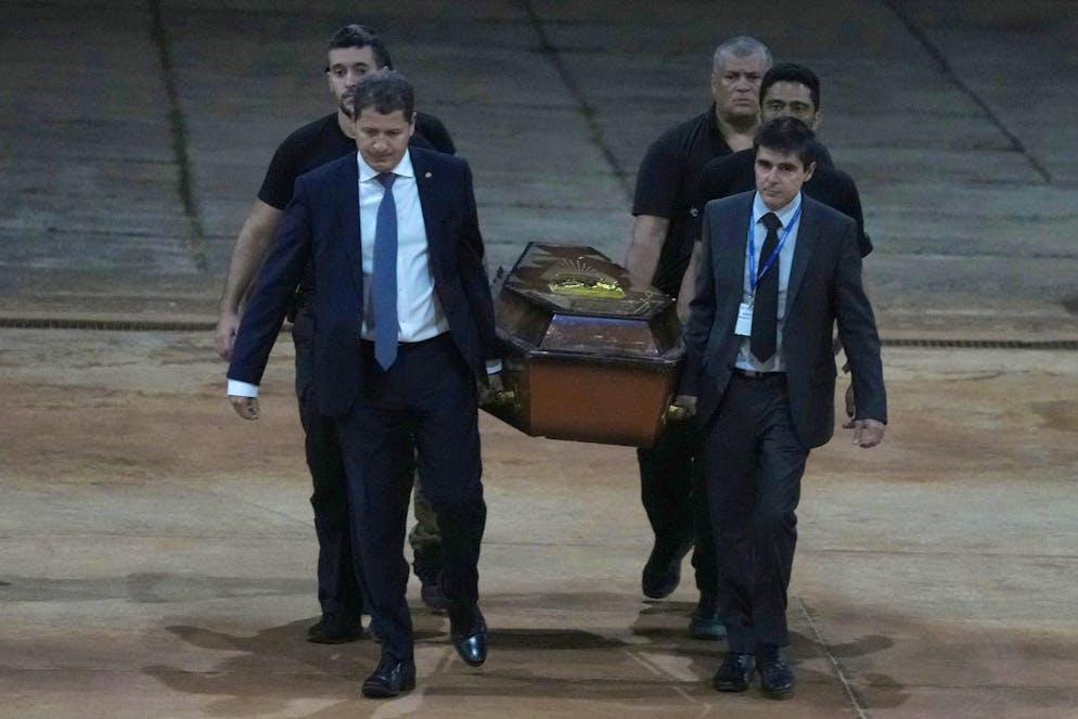 Federal police officers arrive with recovered human remains believed to be of the Indigenous expert Bruno Pereira of Brazil and freelance reporter Dom Phillips of Britain, at the Federal Police hangar in Brasàlia, Brazil, Thursday,, June 16, 2022. A federal police investigator said a suspect confessed to fatally shooting Pereira and Phillips in a remote part of the Amazon and took officers to where the bodies were buried. (AP Photo/Eraldo Peres)