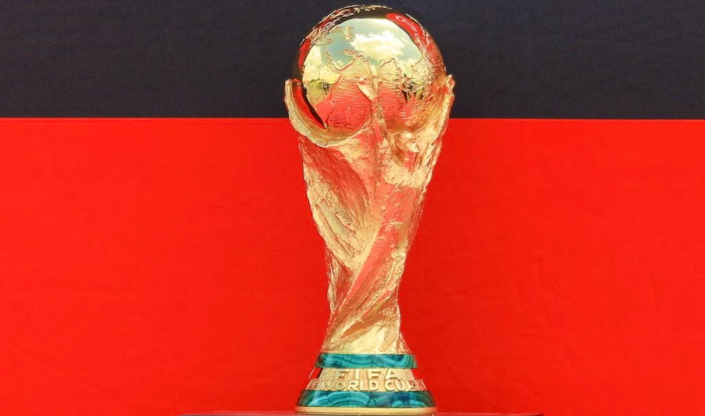 epa09977427 FIFA World Cup Trophy is displayed after its arrival at the Jomo Kenyatta airport in Nairobi, Kenya, 26 May 2022. The trophy will be paraded on 27 May in Nairobi. The public and invited guests will get a chance to view and take a photo with it. During the worldwide Tour of the Trophy, it is expected that the Cup will be shown in at least 22 countries. EPA/Daniel Irungu