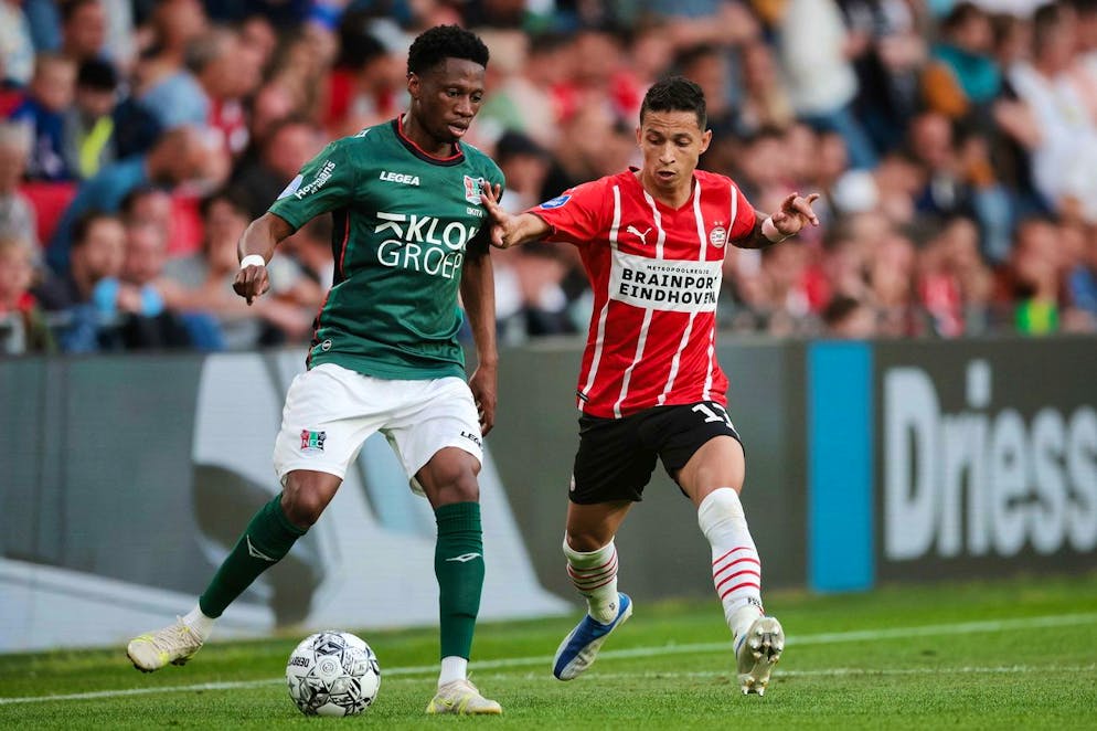 epa09940861 Jonathan Okita (L) of NEC and Mauro Junior of PSV Eindhoven in action during the Dutch Eredivisie soccer match between PSV Eindhoven and NEC Nijmegen at Phillips Stadium in Eindhoven, Netherlands, 11 May 2022. EPA/Jeroen Putmans