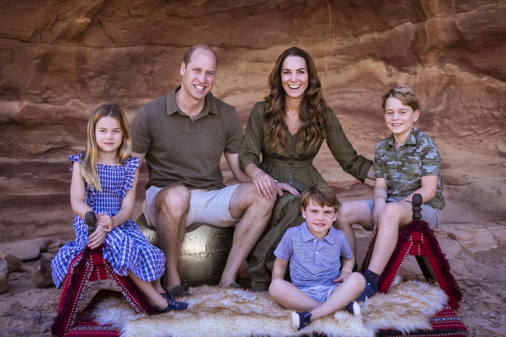 In this undated handout photo provided by Kensington Palace on Friday, Dec. 10, 2021, Britain's Prince William and Kate, Duchess of Cambridge pose with their children Prince George, right, Princess Charlotte and Prince Louis for their annual Christmas card, during their visit to Jordan. (Kensington Palace via AP)