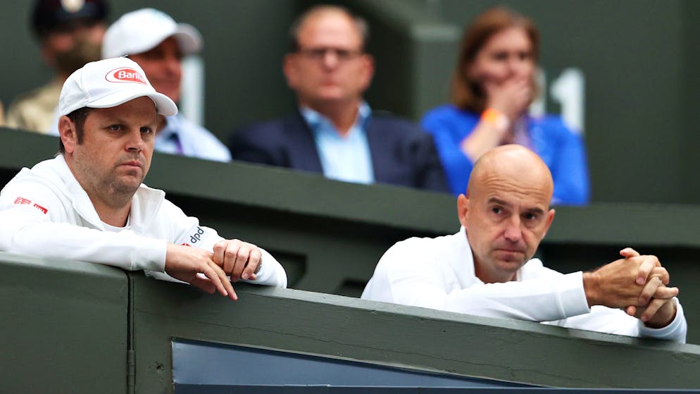 LONDON, ENGLAND - JUNE 29: Severin Luthi and Ivan Ljubicic, coaches of Roger Federer of Switzerland look on from the stands in his Men's Singles First Round match against Adrian Mannarino of France and during Day Two of The Championships - Wimbledon 2021 at All England Lawn Tennis and Croquet Club on June 29, 2021 in London, England. (Photo by Julian Finney/Getty Images)
