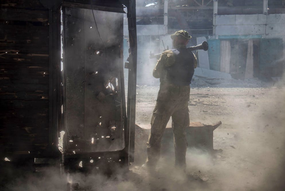 epaselect epa10026520 A Ukrainian serviceman shoots at a position in the city of Severodonetsk of Luhansk area, Ukraine 19 June 2022 (issued 21 June 2022). The city of Severodonetsk and its surroundings witnessed heavy fighting for the last days. Ukrainian troops control a part of city include the Azot plant where 568 people, including 38 children, remain in the bomb shelters, the head of the Luhansk Regional State Administration Serhiy Haidai said on June 21. On 24 February Russian troops entered Ukrainian territory starting a conflict that has provoked destruction and a humanitarian crisis. EPA/OLEKSANDR RATUSHNIAK