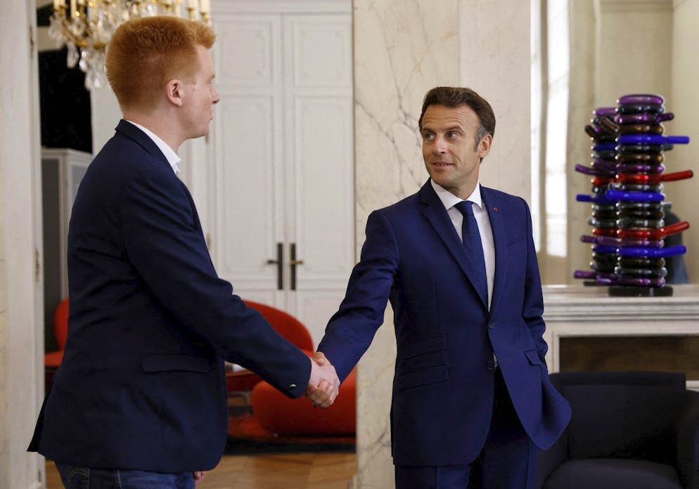 French President Emmanuel Macron, right, accompanies Adrien Quatennens, member of French parliament of French far-left opposition party La France Insoumise (France Unbowed) after their meeting at the Elysee Palace in Paris, Wednesday, June 22, 2022. French President Emmanuel Macron has held talks with France's main party leaders after his centrist alliance failed to win an absolute majority in parliamentary elections. (Gonzalo Fuentes/Pool via AP)
