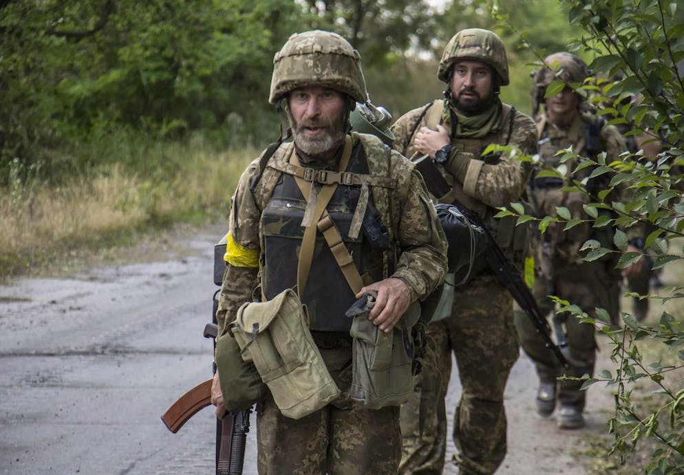 epa10026546 Ukrainian servicemen go to a position in the city of Severodonetsk of Luhansk area, Ukraine, 19 June 2022 (issued 21 June 2022). The city of Severodonetsk and its surroundings witnessed heavy fighting for the last days. Ukrainian troops control a part of city include the Azot plant where 568 people, including 38 children, remain in the bomb shelters, the head of the Luhansk Regional State Administration Serhiy Haidai said on June 21. On 24 February Russian troops entered Ukrainian territory starting a conflict that has provoked destruction and a humanitarian crisis. EPA/OLEKSANDR RATUSHNIAK