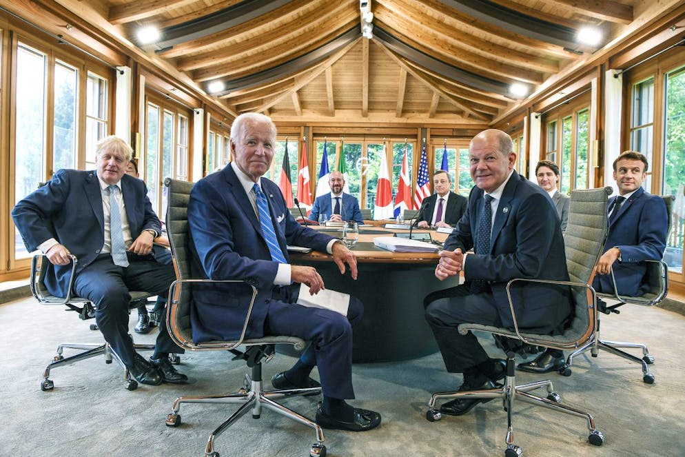 U.S. President Joe Biden, center, attends a working lunch with other G7 leaders to discuss shaping the global economy. Clockwise from left, Fumio Kishida (covered), Prime Minister of Japan, Ursula von der Leyen (covered), President of the European Commission, Charles Michel, President of the European Council, Mario Draghi, Prime Minister of Italy, Justin Trudeau, Prime Minister of Canada, Emmanuel Macron, Prime Minister of France, German Chancellor Olaf Scholz, US President Joe Biden and Boris Johnson, Prime Minister of the United Kingdom sit at the first working session in Castle Elmau in Kruen, near Garmisch-Partenkirchen, Germany, on Sunday, June 26, 2022. The Group of Seven leading economic powers are meeting in Germany for their annual gathering Sunday through Tuesday. (Kenny Holston/The New York Times via AP, Pool)