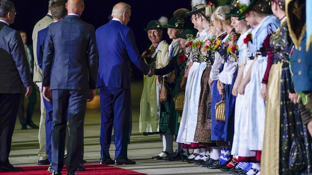 President Joe Biden shakes hands with a greeter as he arrives at Munich International Airport in Munich, Germany, Saturday, June 25, 2022. Biden is in Germany to attend a Group of Seven summit of leaders of the world's major industrialized nations. (AP Photo/Susan Walsh)