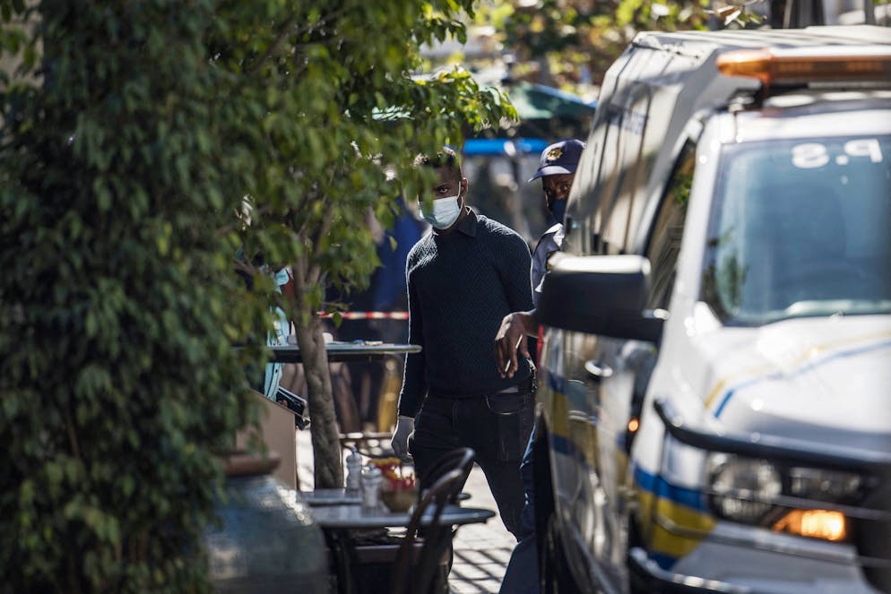 South African Police Services officers work at the site of a fatal shooting in the Rosebank Mall in Johannesburg, on June 09, 2022. (Photo by MARCO LONGARI / AFP) (Photo by MARCO LONGARI/AFP via Getty Images)