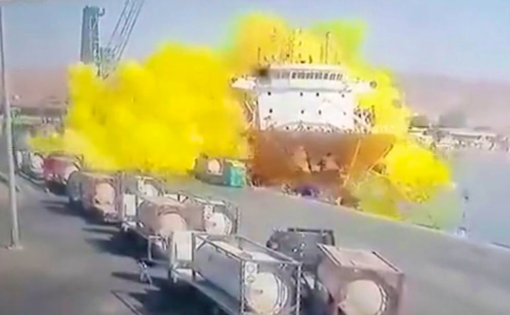 This photo taken from CCTV video broadcasted by Al-Mamlaka TV shows a chlorine gas explosion after it fell off a crane in the port of Aqaba, Jordan, Monday, June 27, 2022. Some dozen workers were killed and scores were hospitalized. (Al-Mamlaka TV via AP)