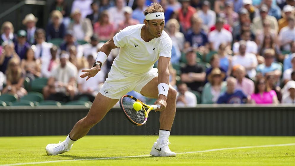 Spain's Rafael Nadal returns to Argentina's Francisco Cerundolo in a first round men's singles match on day two of the Wimbledon tennis championships in London, Tuesday, June 28, 2022. (AP Photo/Alberto Pezzali)