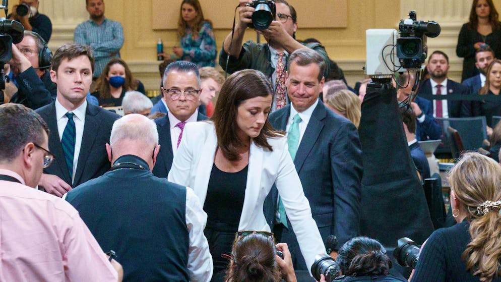 Cassidy Hutchinson, an aide to then White House chief of staff Mark Meadows, stands up at the start of a break during a House Select Committee hearing to Investigate the January 6th Attack on the US Capitol, in the Cannon House Office Building on Capitol Hill in Washington, DC on June 28, 2022. POOL/AFP PHOTO/Mandel Ngan