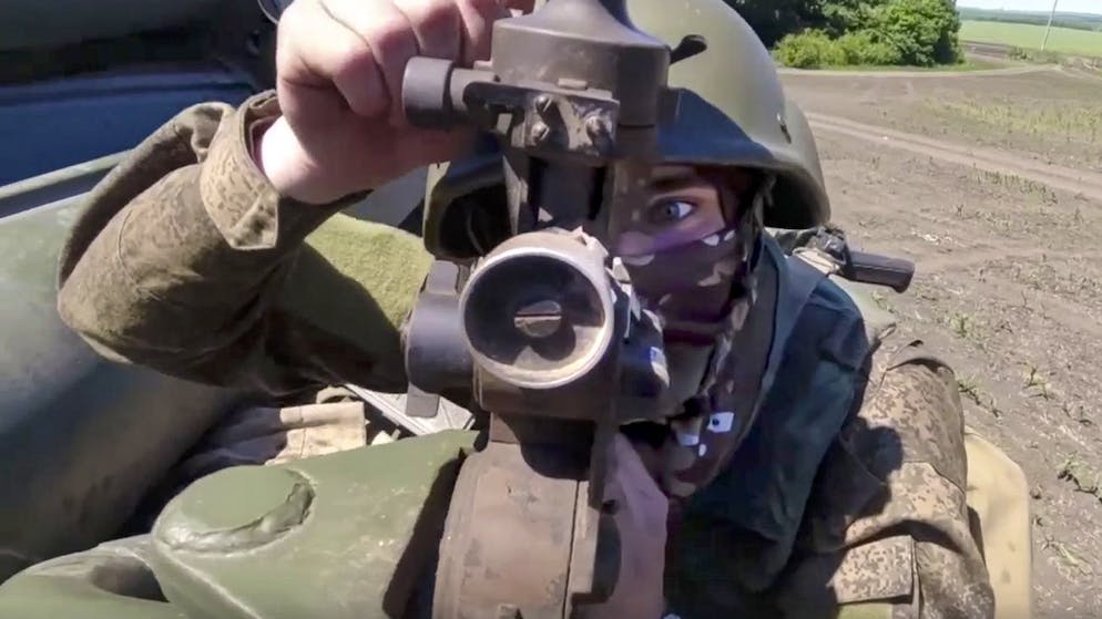 In this handout photo released by Russian Defense Ministry Press Service released on Saturday, June 25, 2022, A Russian gunner prepares to fire at Ukrainian troops at an undisclosed location. (Russian Defense Ministry Press Service via AP)