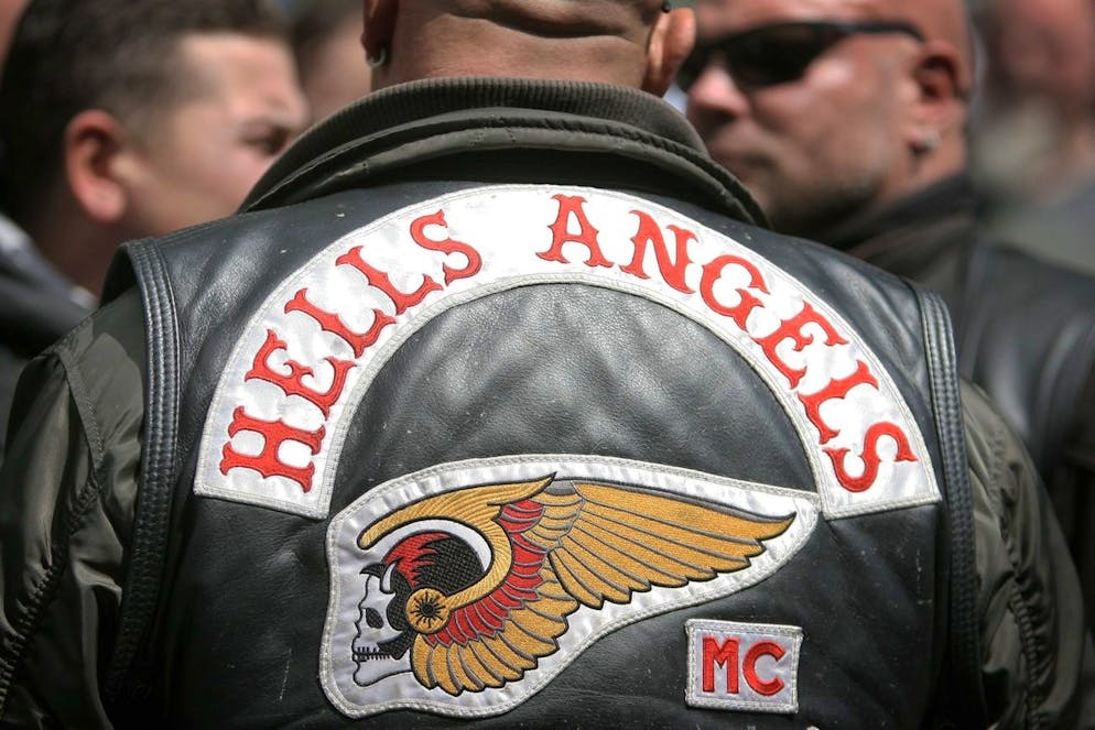 epa03306543 Members of the motorcycle club Hells Angels attend a protest action in Frankfurt Main, Germany, 14 July 2012. About 300 members of motorcycle clubs initiated a motorcade through the city of Frankfurt to protest against the prohibition of motorcycle clubs. The protest comes after earlier in July armed German police raided homes and clubhouses of several biker gangs who are accused of mafia-style operations, earning money from prostitutes, protection rackets and sales of guns and drugs. EPA/FREDRIK VON ERICHSEN