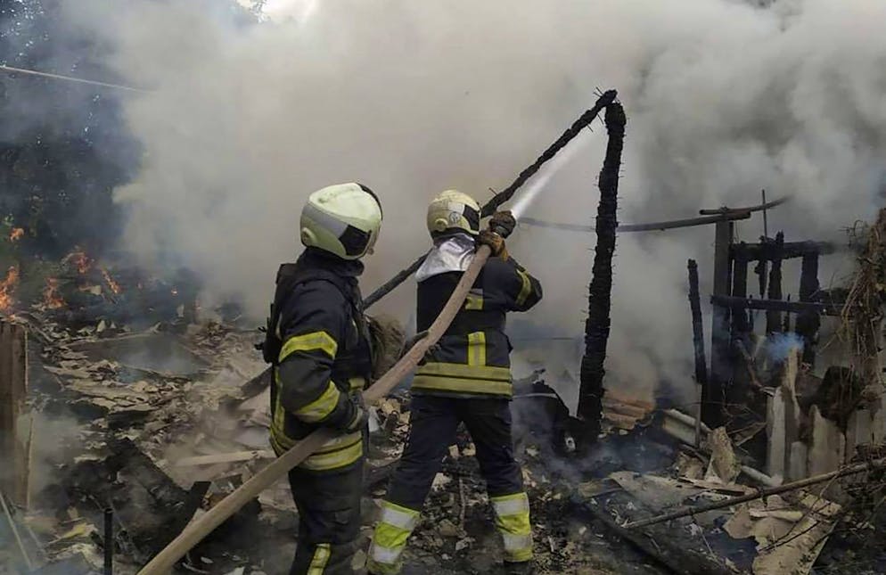 In this photo provided by the Luhansk region military administration, Ukrainian firefighters work to extinguish a fire at damaged residential building in Lysychansk, Luhansk region, Ukraine, early Sunday, July 3, 2022. Russian forces pounded the city of Lysychansk and its surroundings in an all-out attempt to seize the last stronghold of resistance in eastern Ukraine's Luhansk province, the governor said Saturday. A presidential adviser said its fate would be decided within the next two days. (Luhansk region military administration via AP)
