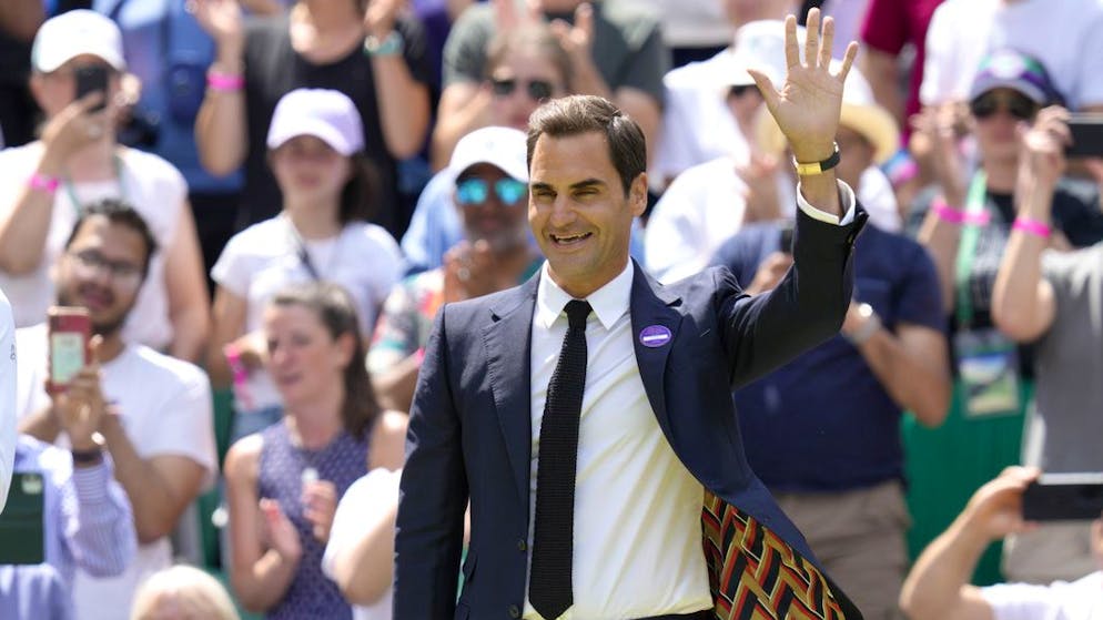 Switzerland's Roger Federer waves during a 100 years of Centre Court celebration on day seven of the Wimbledon tennis championships in London, Sunday, July 3, 2022. (AP Photo/Kirsty Wigglesworth)
