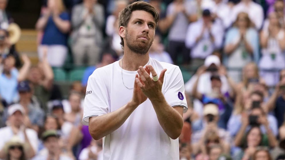 Britain's Cameron Norrie celebrates defeating Tommy Paul of the US in a men's fourth round singles match on day seven of the Wimbledon tennis championships in London, Sunday, July 3, 2022. (AP Photo/Alberto Pezzali)