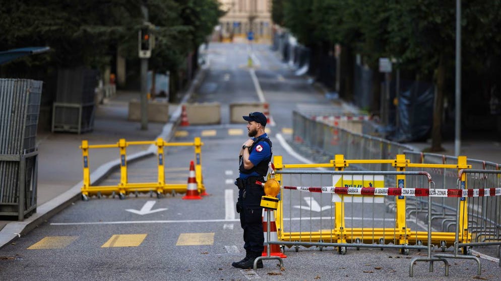 epa10050975 A police officer stands at a roadblock near the Palazzo dei Congressi before the Ukraine Recovery Conference URC, in Lugano, Switzerland 04 July 2022. The URC is organised to initiate the political process for the recovery of Ukraine. EPA/MICHAEL BUHOLZER