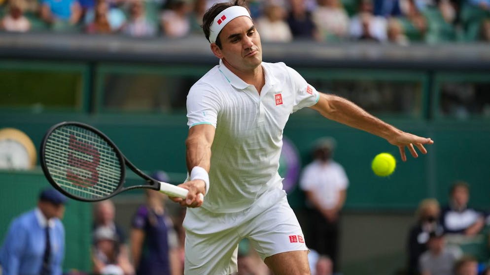 Switzerland's Roger Federer plays a return to Richard Gasquet of France during the men's singles second round match on day four of the Wimbledon Tennis Championships in London, Thursday July 1, 2021. (AP Photo/Alberto Pezzali)